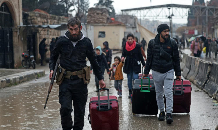 Syrian army says controls Aleppo district, Kurdish forces deny claim