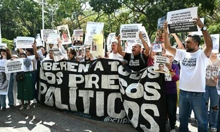 Venezuela moves to boost economy, amid anguish over pace of prisoner release