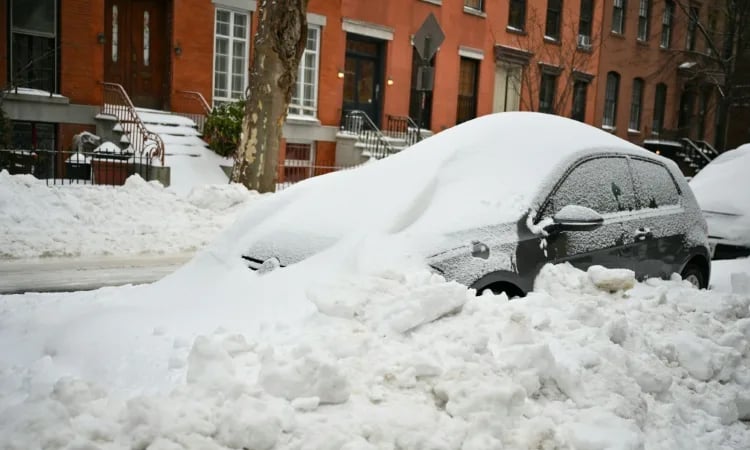Extreme cold grips millions as US digs out of deadly snowstorm