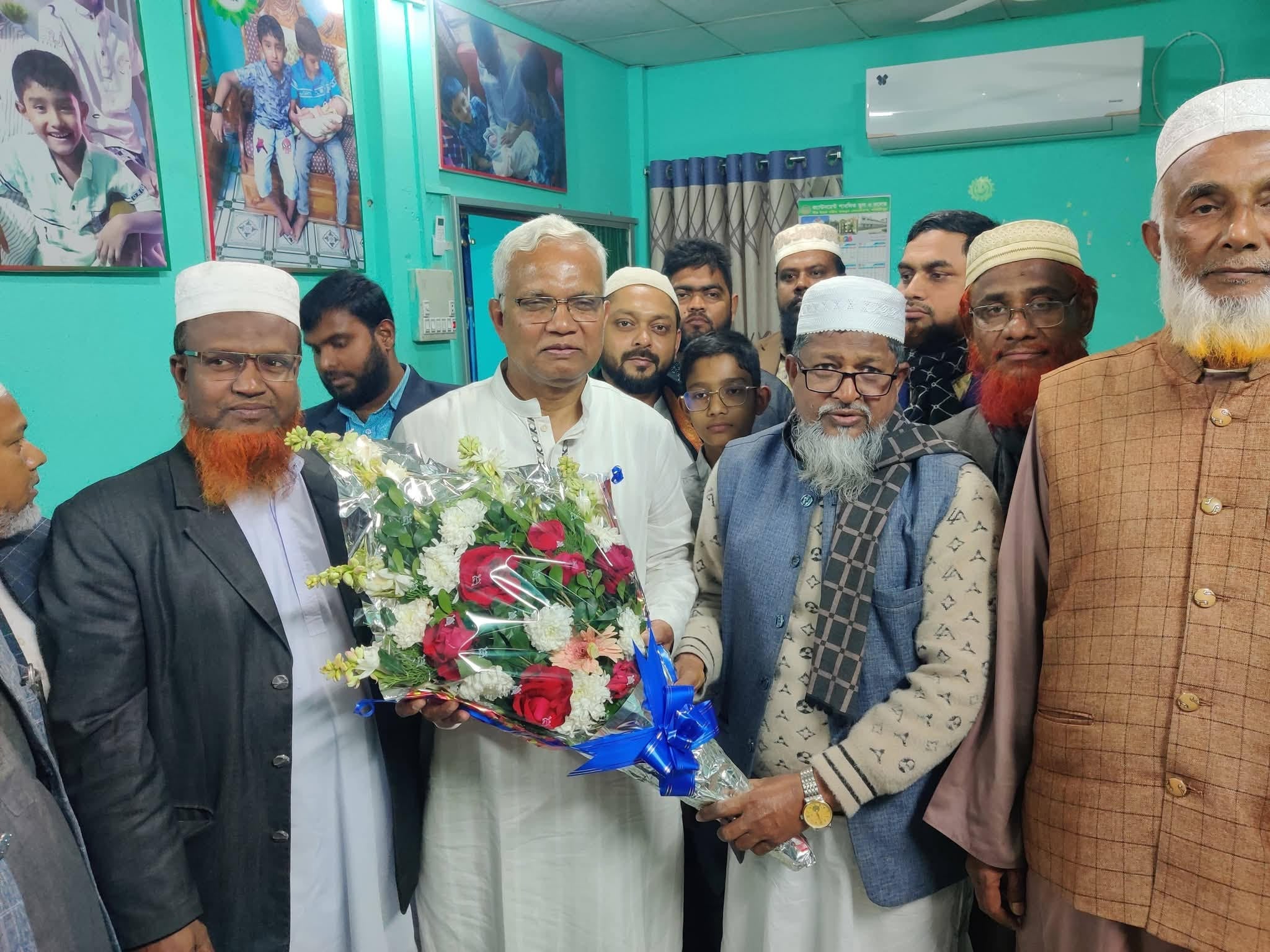 Jamaat's Anwarul from Dinajpur-6 greets winner Dr. Zahid