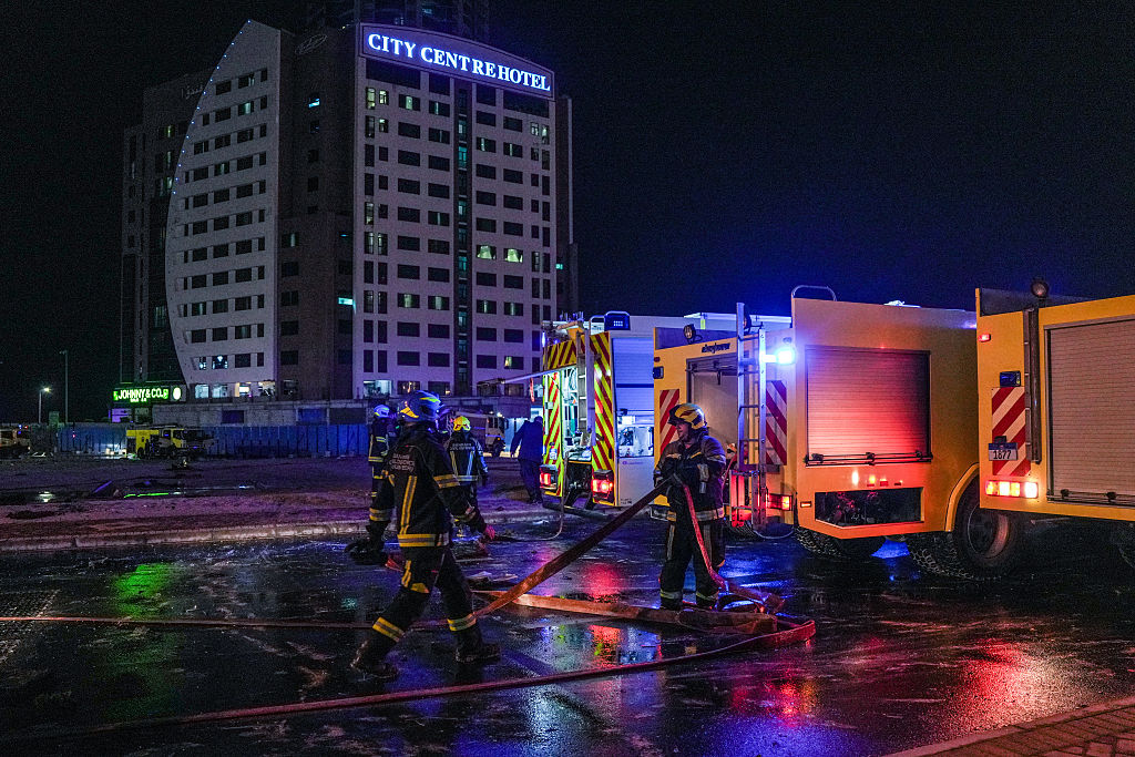 Two dead as Iran launches waves of strikes on wealthy Gulf