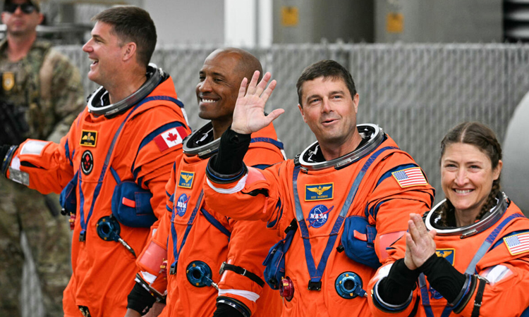 Astronauts strapped in for historic US lunar launch