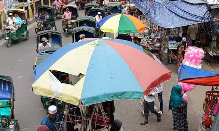 Small vendors occupy wide footpaths in Rajshahi city