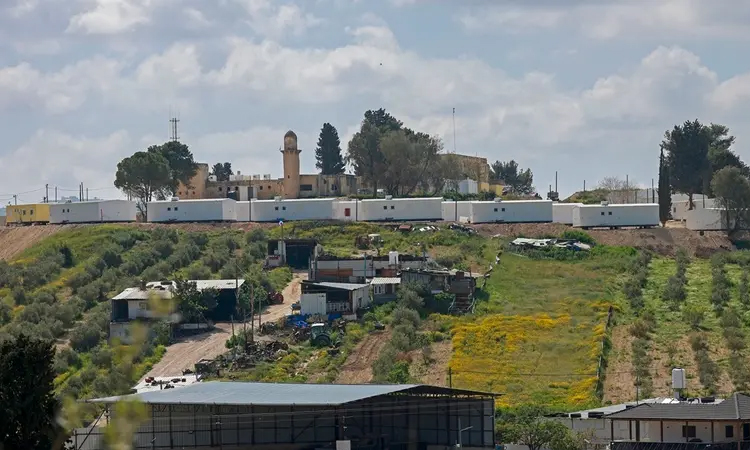 Palestinians say Israeli settlers kill man in raid on village