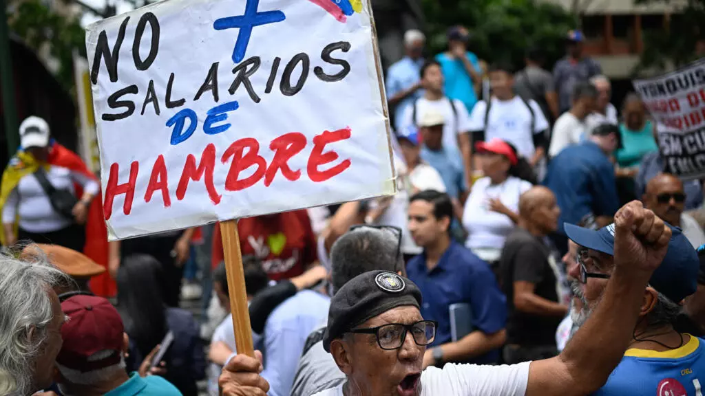Venezuelan protesters call government wage hike a joke