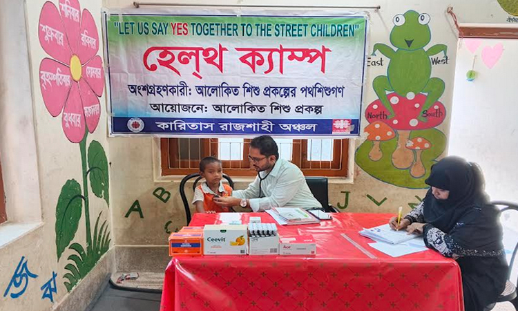 Free health camp under Alokito Shishu Project held in Rajshahi