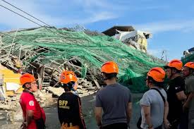 Rescuers search for 20 missing at collapsed Philippine building