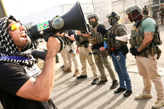 State, federal authorities spar amid protests at US immigration detention center