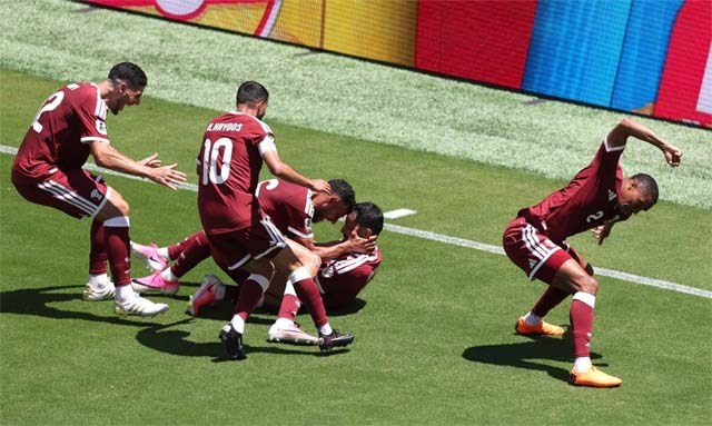 Qatar earn first ever World Cup point with late goal