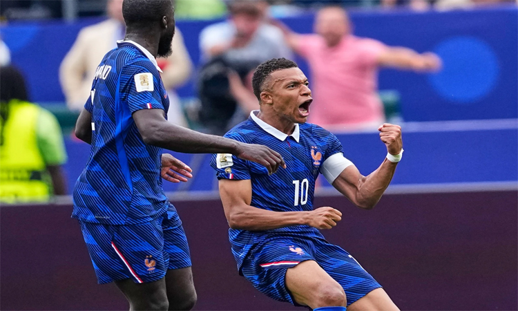 Mbappe scores twice as France beat Iraq at World Cup after two-hour storm delay