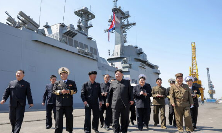 North Korea's Kim unveils plans for 10,000-ton warships, nuclear navy