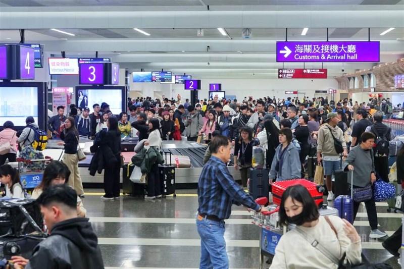 Japan cancels 100 flights as twin storms approach