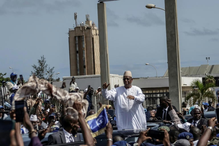 Ex-president Sall back in Senegal for talks with successor