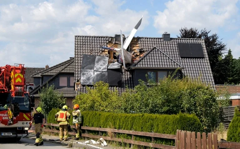 Two dead after plane crashes onto German house's roof