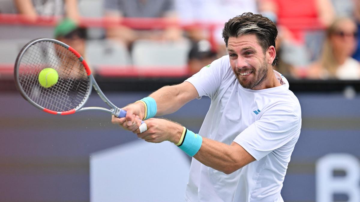 Battling Norrie survives match point to oust de Minaur