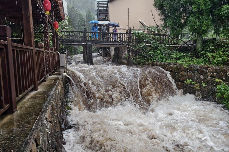 Typhoon Dolphin weakens but disrupts travel in east China