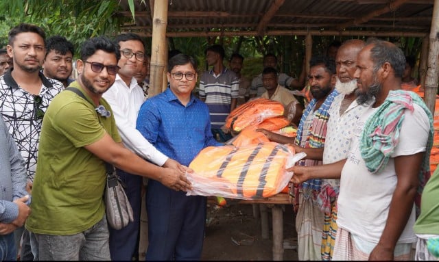 RCC Administrator distributes life jackets for safety of boat passengers 