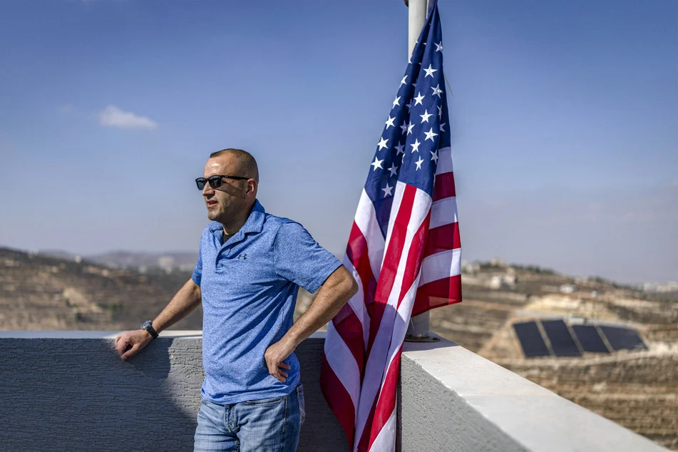Palestinian-American hoists US flag on home besieged by settlers