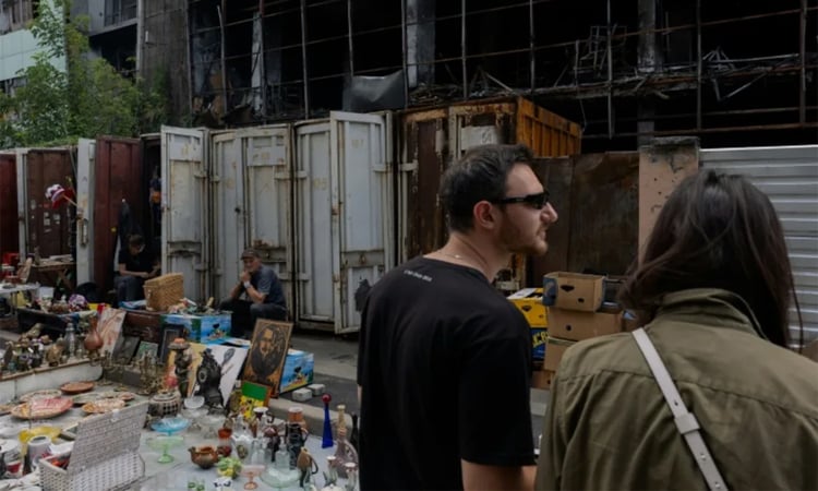 Kyiv's desperate vendors persevere outside obliterated flea market