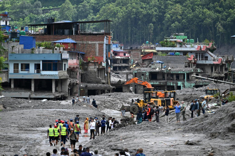 Nepal flood survivors return to ruins to salvage memories