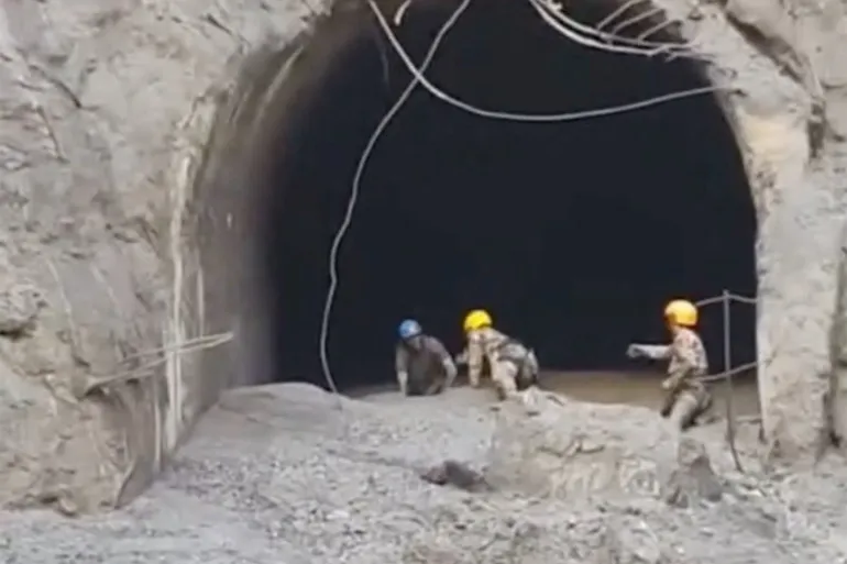 Nepal recovers bodies but presses on for trapped tunnel workers