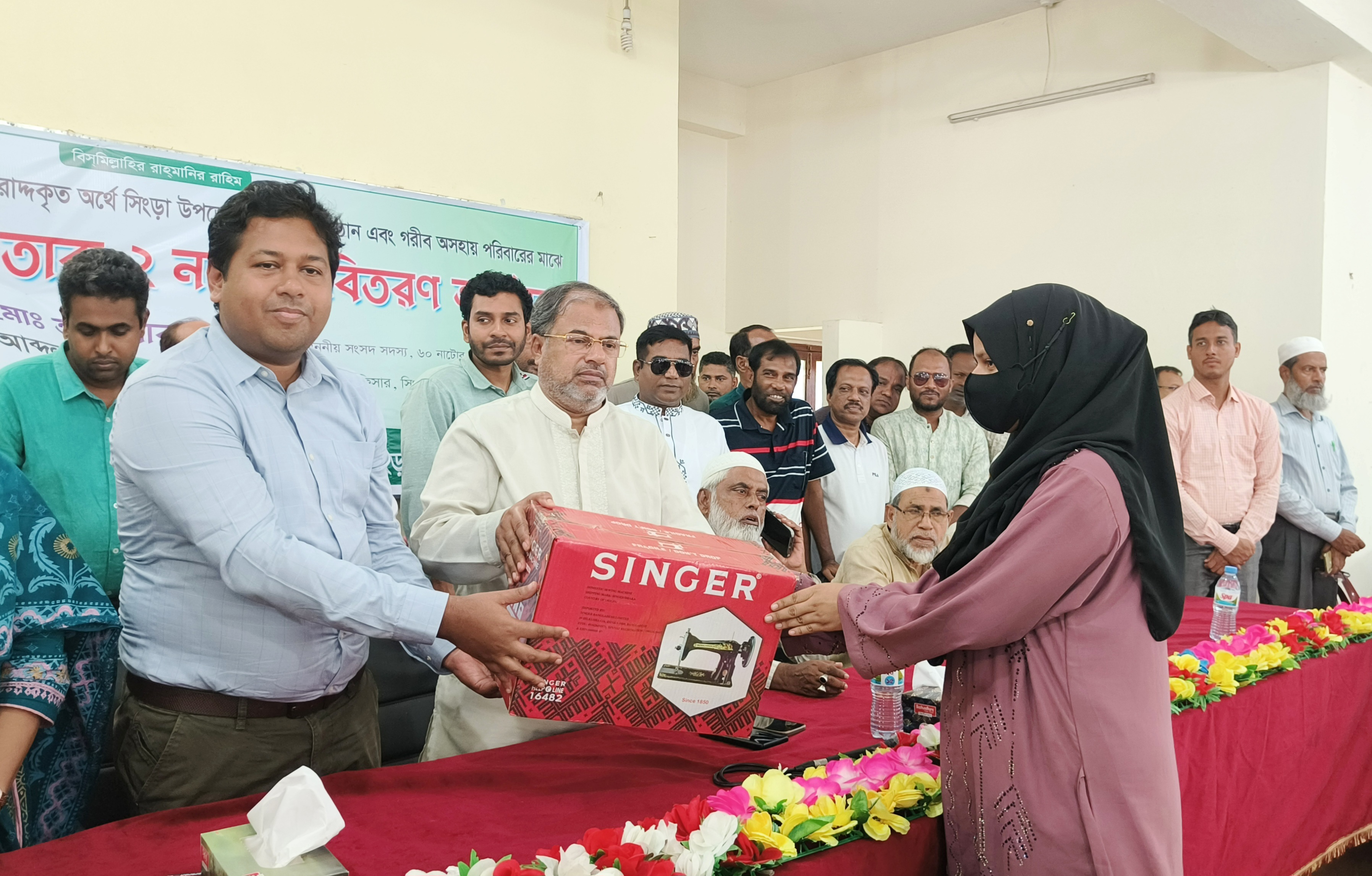 নাটোরে সেলাই মেশিন ও নলকূপ বিতরণ 